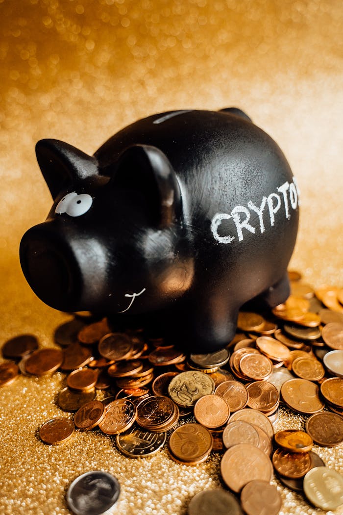 our-services-3 A black piggy bank labeled 'CRYPTO' surrounded by various coins on a gold background.
